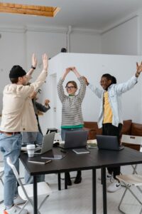 a group of people celebrating together at work