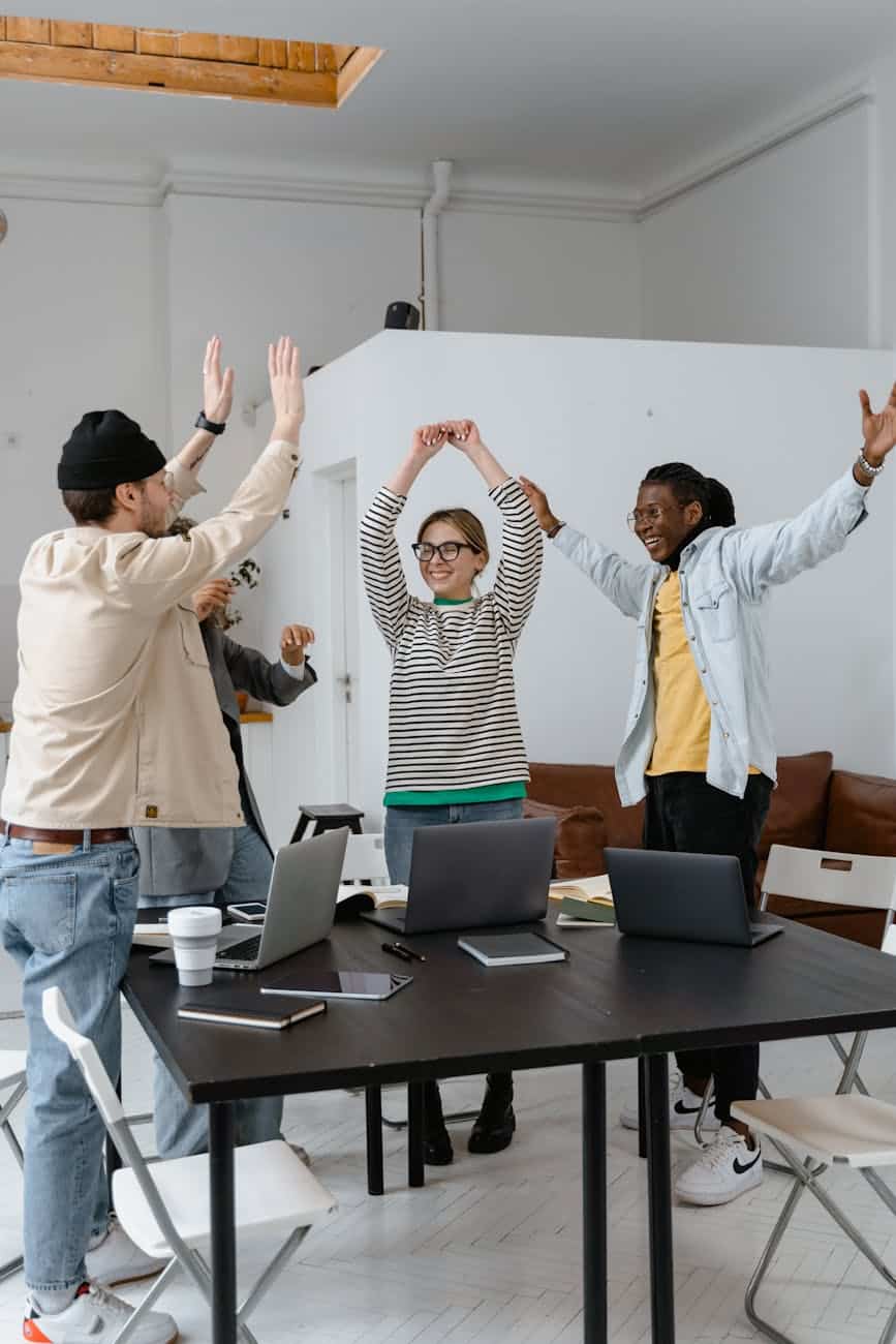 a group of people celebrating together at work